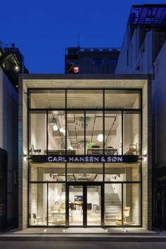 the entrance to carl hansson and son's store in new york city at night