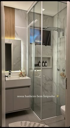 a bathroom with a shower, sink and toilet in the corner next to a mirror