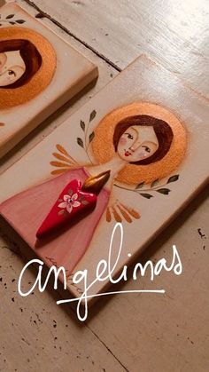 two wooden plaques with faces on them and the words angellims written below it