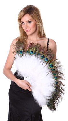 a woman in a black dress holding a white and blue feather fan with her right hand on her hip