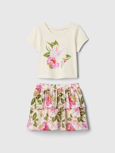 Soft cotton T-shirt and skirt outfit set.  Round neck.  Short sleeves.  Elasticized waist at skirt.  Ruffled skirt.  Allover prints.  Straight, easy fit.  Easy pull-on waist.  Sizes range from baby to toddler. Baby Silk Skirts, Casual Spring Sets With Tiered Skirt, Casual Summer Skirt Set, Gap Cotton Summer Sets, Casual Gap Sets For Spring, Spring Cotton Skirt By Gap, Fitted Cotton Skirt By Gap, Cotton Sets With Elastic Waistband And Short Sleeves, Summer Casual Sets By Gap