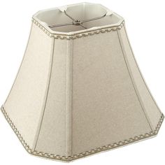 a white lamp shade with beading on the bottom and an off - white base