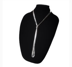 The liquid-like texture of the sterling silver cylinders  strung together by hand gives to this this lovely layering long necklace the flexibility to be worn long, wrapped or doubled up. Stylishly sleek, extra slick and easy to wear, is the versatile multi-way necklace your or her jewelry collection craves! Wear it lasso style or create custom layered looks. Check out pictures for ideas. Our Liquid Silver Necklace with 10 strands is a great gift idea for wives, moms, teachers, sisters or any oth Silver Lariat Necklace For Party, Silver Long Drop Lariat Necklace For Formal Occasions, Silver Lariat Chain Necklace For Layering, Elegant Long Drop Silver Chain Necklace, Adjustable Silver Long Necklace For Formal Occasions, Silver Multi-strand Adjustable Lariat Necklace, Adjustable Multi-strand Silver Lariat Necklace, Silver Lariat Long Necklace As Gift, Silver Lariat Long Necklace For Gift