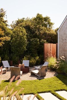 an outdoor patio with lawn furniture and trees in the backgroung area, next to a shed