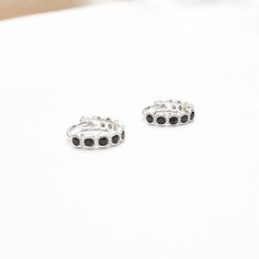 A Pair Of Sterling Silver 925 BLACK CZ Hoop EarringsEarring Inner Diameter: 9 mmEarrings are also available in 14k Gold Filled.♥♥♥♥► Nickel Free► Tarnish Resistant► No Allergic reaction► 30 days return policy► Accept replacements and custom orders♥♥♥♥► I ship all items in a jewelry gift box► Greeting card - upon request♥♥♥♥Shipping information :► Tracking number► Expedited / Express shipping - additional payment¨¨¨¨°º©©º°¨¨¨¨¨¨°º©©º°¨¨¨¨► My Shop: https://www.etsy.com/shop/JewelsByMoonli ¨¨¨¨°º© Adjustable Sterling Silver Huggie Earrings For Anniversary, Black Minimalist Sterling Silver Cartilage Earrings, Adjustable Minimalist Cubic Zirconia Earrings, Adjustable Sterling Silver Huggie Earrings With Matching Set, Black Sterling Silver Hoop Earrings For Everyday, Black Sterling Silver Small Hoop Earrings, Black Minimalist Sterling Silver Hoop Earrings, Everyday Black Sterling Silver Hoop Earrings, Nickel-free Black Huggie Jewelry