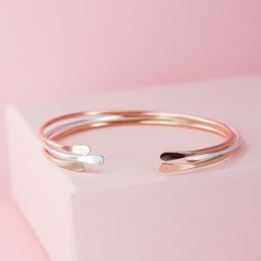 "These skinny cuffs are available in recycled silver, gold and rose gold fill. Layer up these 2mm bangles with your other jewelry. They are flexible, comfortable, and dainty, and are meant to be squeezed down on your wrist. I offer these with both or neither end hammered, if you would like only one end hammered include it in a note when you check out. These cuffs are made from solid sterling silver and 14K gold filled, which means they are safe to wear every day, even in the shower. Gold filled Bracelets Unique, Stacking Bracelets, Bangles Making, Stacked Bangles, Gold Cuffs, Recycled Silver, Unique Gifts For Her, Sterling Silver Cuff, Silver Cuff Bracelet