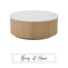 a white marble top coffee table with the words buy it here