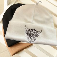 Handcrafted Embroidered Highland Cow Beanie Hat. Made With High Quality Polyester Black Thread. White Knit Construction 100% Acrylic One Size Fits Most White Embroidered Beanie Hat, White Winter Hat With Embroidered Logo, Cow Beanie, Pageboy Hat, Jack Hat, Patagonia Hat, Pink Beret, Raffia Sun Hat, Brixton Hat