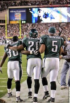 the philadelphia eagles huddle together on the sidelines before their game against the new york jets