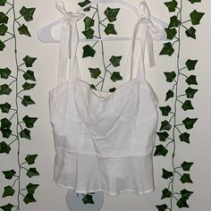 Urban Romantics White Tops Tied Straps On Shoulder Tag Still Attached, Never Worn No Size Tag But I’m A Medium So Most Likely A Medium Smoke Free/Pet Free Home Fitted Cropped Tops With Tie Straps, White Cotton Tank Top With Tie Back, White Cropped Tie Back Top, Summer Sleeveless Top With Tied Detail, Chic White Top With Knotted Straps, Sleeveless Tied Top For Summer, Fitted Tied Crop Top, White Strapped Crop Top, White Strap Casual Crop Top