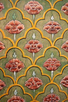 an intricately designed wallpaper with red flowers on green and yellow background, from the late 19th century