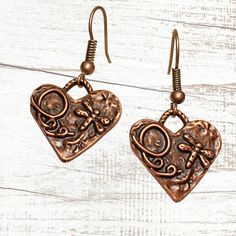 Copper Bohemian heart earrings with rustic charms. Beautifully detailed charms feature dragonflies! Lightweight earrings for casual or dressy occasions. Very pretty and versatile, these earthy minimalist earrings complement any style. Free gift packaging included, earrings are carded and in a gift bag. Customize them with your choice of hypoallergenic ear wires at checkout. To see more of my handmade Bohemian and Czech glass bead earrings, visit this link to my shop: https://www.etsy.com/shop/Je Bohemian Metal Heart Earrings As Gift, Bohemian Style Heart Earrings As A Gift, Bohemian Nickel Free Heart Earrings, Earthy Minimalist, Copper Earrings Handmade, Glass Bead Earrings, Copper Heart, Reno Nv, Lightweight Earrings