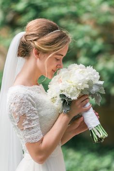 a woman in a wedding dress holding a bouquet