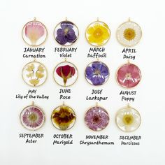 a bunch of flowers that are in different types of glass cabochons on a white surface