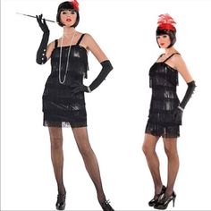 two women dressed in flappers and gats