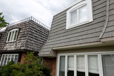 there are two windows on the roof of this house