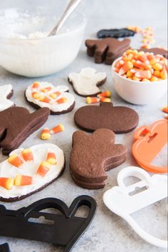 some cookies and candy are laying out on the table