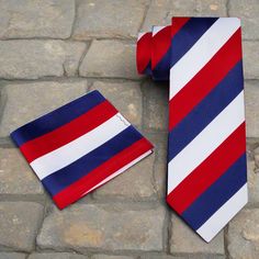 Command Attention with the Timeless Elegance of the Red, White, and Dark Blue Block Stripe Silk Necktie In the realm of men's fashion, a necktie isn't just an accessory; it's a powerful expression of personal style and sophistication. Our Red, White, and Dark Blue Block Stripe Silk Necktie is a testament to timeless elegance, seamlessly blending the luxurious feel of silk with a striking block stripe pattern. Available in both traditional and thin widths, this necktie is meticulously crafted to Blue Block, Stripe Silk, Color Theme, Silk Necktie, Striped Tie, Tie And Pocket Square, Color Themes, Necktie, Deep Purple