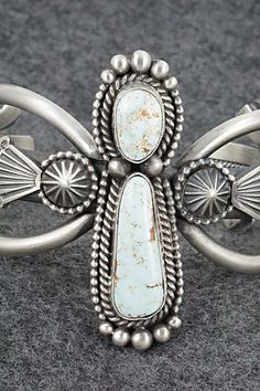 This stunning Dry Creek turquoise and sterling silver bracelet was made by Navajo silversmith Michael Calladitto. The inside is signed MC and stamped sterling.Size: 5 1/2" (will fit up to a 6 3/4" wrist)Gap: 1 1/4"Width: 2 1/8"Free shipping on all orders! We ship with USPS and always include tracking. All orders ship within a day of payment.Returns are accepted up to 30 days after you receive your order. Just send us a message. Our shop offers cash back or store credit. The item must be returned Western Silver Bracelet With Patina, Southwestern Silver Jewelry With Patina, Southwestern Silver Cuff Bracelet, Silver Western Cuff Bracelet With Patina, Collectible Southwestern Style Silver Turquoise Ring, Elegant Silver Bracelets With Patina, Elegant Silver Patina Bracelets, Western Style Silver Bracelet Jewelry, Western Style Silver Bracelet