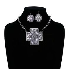 Beautiful engraved silver metal cross pendant is 2 1/2" x 2 1/2" on a 16.5" chain w/ lobster clasp & 3" ext. chain. Matching pierced hook earrings are 1" x 1" and hang 1 1/2" from top of wires. Free shipping. Metal Cross, Western Design, Silver Engraving, Necklace Earring Set, Hook Earrings, Cross Pendant, Lobster Clasp, Earring Set, Metallic Silver