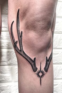 a man's thigh with antlers on it