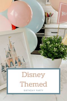 a birthday party with balloons and pictures on the table, including a disney themed cake