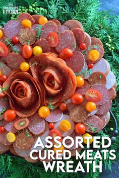 an assortment of cooked meats and vegetables on a platter with text overlay