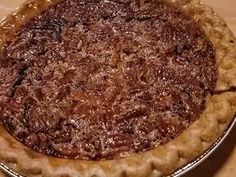 a chocolate pie sitting on top of a wooden table