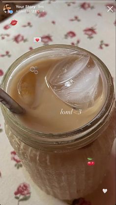 a jar filled with liquid sitting on top of a table