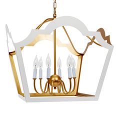 a white and gold chandelier with five lights hanging from it's sides