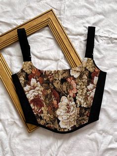 Black floral Renaissance style corset made from black corduroy and combined with floral tapestry fabric  * Straps are adjustable at the back *The corset top has lacing at the back, which allows you to adjust the fit to your figure, and stainless steel eyelets *The corset has plastic bones inserted into it for a good fit. *The corset has a cotton lining ✅ Corset is Made to Order Please,  enter your measurements in personalization: Bust and Waist ❣️This corset can be sewn to fit a bust up to 108 c Floral Print Overbust Corset With Fitted Bodice, Vintage Fitted Floral Print Corset, Vintage Floral Print Fitted Corset, Fitted Vintage Floral Print Corset, Vintage Overbust Corset With Floral Print, Vintage Overbust Floral Print Corset, Vintage Floral Print Overbust Corset, Korsett Top, Victorian Corset