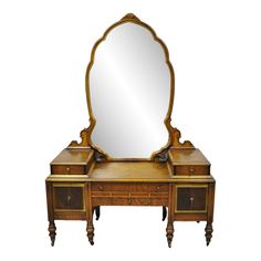 an antique dressing table with mirror and drawers