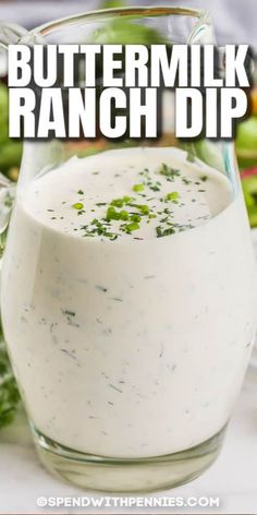 buttermilk ranch dip in a glass pitcher with celery on the side