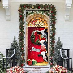 a door decorated with christmas decorations and wreaths