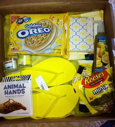 an open box filled with food and snacks