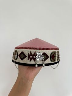 This stunning Kazakh & Kyrgyz headdress is a traditional piece of clothing worn in Central Asia, particularly in Kazakhstan and Kyrgyzstan. It is an important part of the region's cultural heritage, and has been worn by women for centuries. Made with high-quality materials and featuring intricate embroidery and beadwork, this headdress is a true work of art. The design is inspired by the Silk Road, the ancient trade route that connected China to the Mediterranean. The headdress is adorned with c Festival Headband, Headband Size, The Silk Road, Cultural Festival, Intricate Embroidery, Silk Road, World Cultures, Central Asia, Turbans