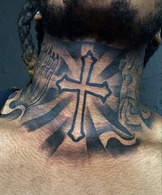 a man with a cross tattoo on his neck