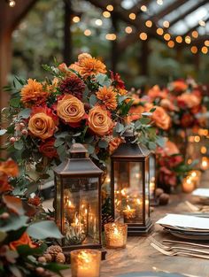 a long table with candles and flowers on it is set up for an outdoor dinner