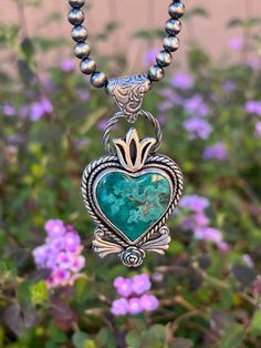 This gorgeous Hubei turquoise heart is nestled in a gorgeous sterling silver setting with a decorative boarder and elements. The pendant measures 2 1/4" x 1 1/4". This is for PENDANT only. Navajo Necklace- length of your choice can be purchased separately. Luxury Heart-shaped Turquoise Necklace, Luxury Turquoise Heart Pendant Necklace, Hubei Turquoise, Navajo Necklace, Sterling Silver Heart Pendant, Turquoise Heart, Jewelry Antique, Silver Heart Pendant