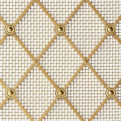 a close up view of a gold metal fence