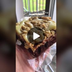 a piece of chocolate chip cheesecake and brownies on a plastic wrapper with the words making chocolate chip cheesecake brownies