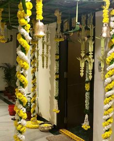 an entrance decorated with yellow and white flowers