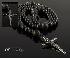 "This shungite catholic rosary is simply necessary for people who are looking for mutual love, as well as for those who want to achieve career growth. This kind of product can be a wonderful present for a representative of any astrological sign, but it especially suits for Sagittarius, Aries or Leo. For people who seeking knowledge, these beads will help to gain clarity of thinking, overcome the apprehension and to maximize the intellectual possibilities. Rosary made of shungite and volcanic lav Black Cross Rosary As Gift, Handmade Black Rosary Bracelet For Gift, Handmade Black Rosary Bracelet Gift, Crucifix Jewelry With Black Beads As Gift, Spiritual Black Rosary Bracelet Gift, Black Crucifix Rosary Bracelet As Gift, Black Crucifix Rosary As Gift, Gift Black Rosary With 8mm Beads, Black Rosary Bracelet With Gemstone Beads As Gift