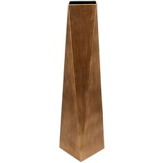 a tall wooden vase sitting on top of a table