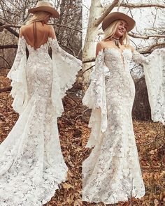 a woman wearing a white dress and hat in the woods