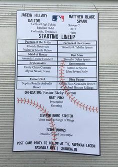 a sign on the side of a building that says starting line up with baseball stitches