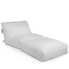 a white chaise lounger sitting on top of a white floor