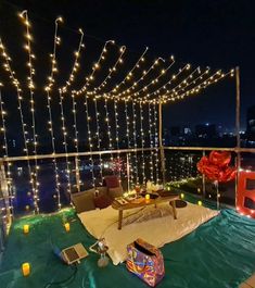 an outdoor deck with lights and decorations on it