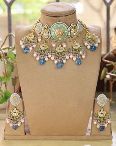 Sabyasachi inspired Kundan Polki necklace of Beads with matching earrings Perfect for any kind of occasions and ceremonies. You can wear it with Saree lehenga and Evening Gowns. Highest quality and craftsmanship. Arrives in box Please let me know if you have any questions Blue Traditional Earrings For Reception, Traditional Blue Earrings For Reception, Blue Fusion Style Jewelry For Wedding, Blue Fusion Style Wedding Jewelry, Traditional Beaded Jewelry Sets For Reception, Beaded Bridal Necklace For Reception, Blue Kundan Necklace With Cutdana For Wedding, Fusion Style Kundan Necklace With Latkans For Wedding, Blue Chandbali Bridal Necklace For Wedding