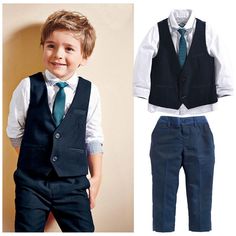 a little boy wearing a blue suit and tie